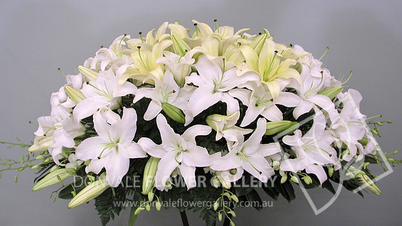 casket flowers - white and lemon mix of lillies