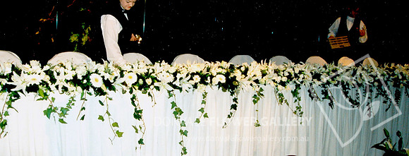 Bridal Table Flowers - white. trailing.